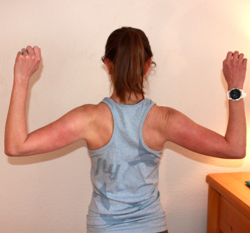 work from home ergonomics for runners to demonstrate shoulder blade squeezes