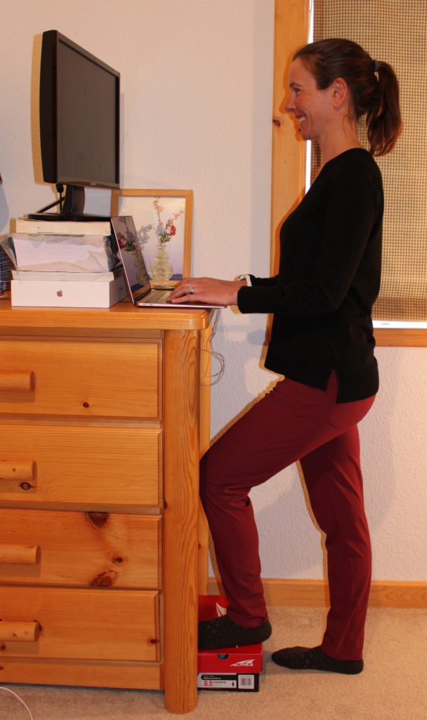 work from home ergonomics for runners to show a piece of furniture being used as a standing desk